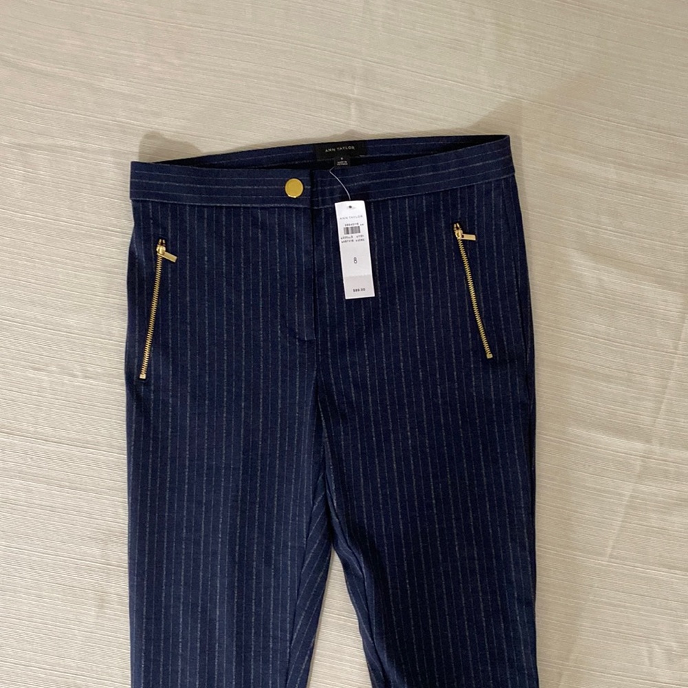 Ann Taylor pants, two pockets w brass zippers, brass button and zipper closure